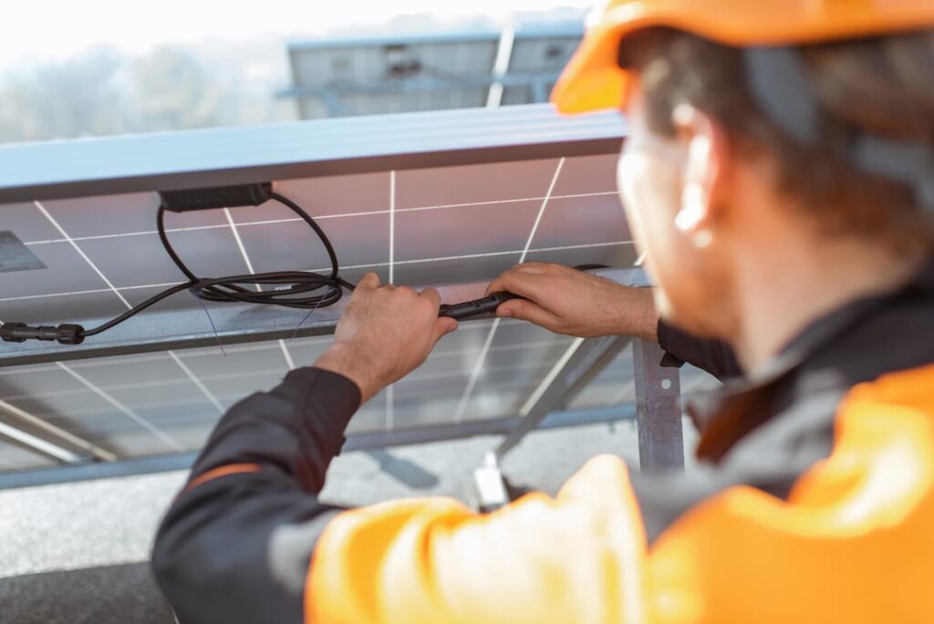 electrician connecting solar panels