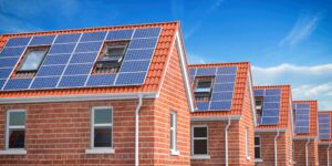 solar panels on red roof homes